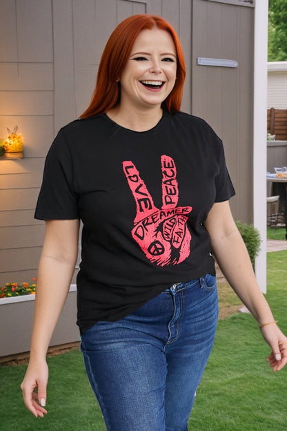 Plus size model wearing graphic black tee with red peace sign