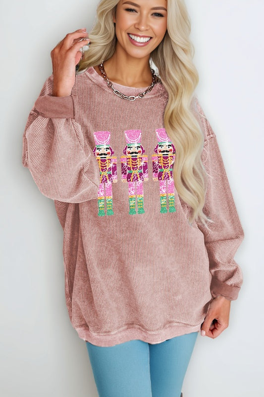 Bring the bling and stay warm all Christmas season with this pink sequined sweatshirt.